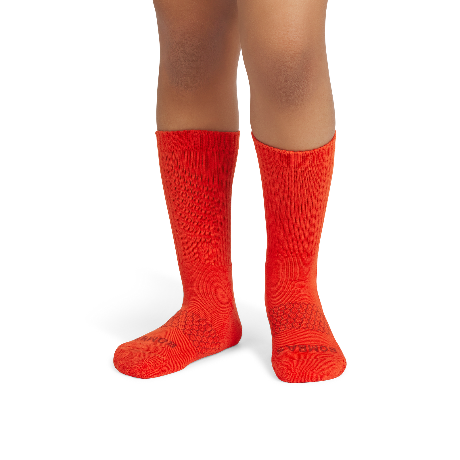 official-bombas::6570-burntorange-rust-youth-unisex-onmodel-2-transparent.png