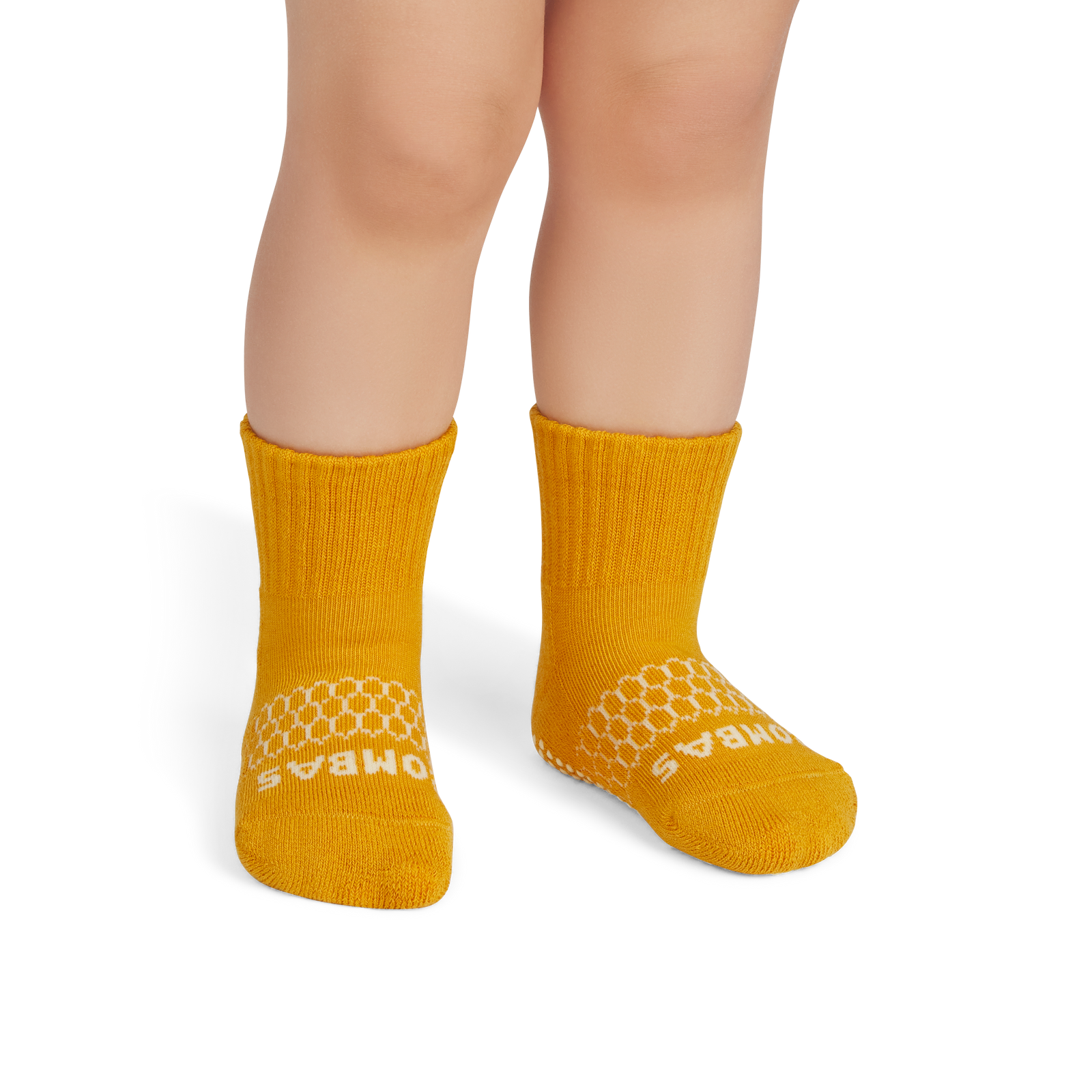 official-bombas::7579-ochre-lightmeringue-toddler-unisex-onmodel-2-transparent.png